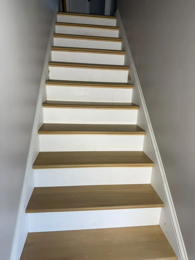 Straight staircase with oak treads and white painted risers